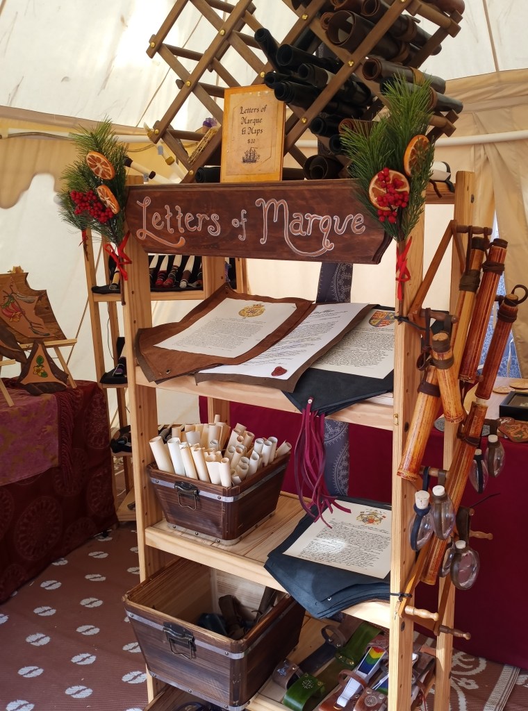Shelf of papers and scrolls with a sign reading Letters of Marque